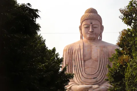 The Great Buddha Statue at Bodh Gaya framed by trees