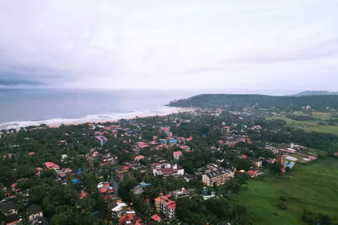 Aerial view of the coastline and rooftops around Calangute, Goa
